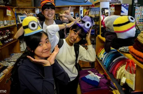 3 international students in a shop