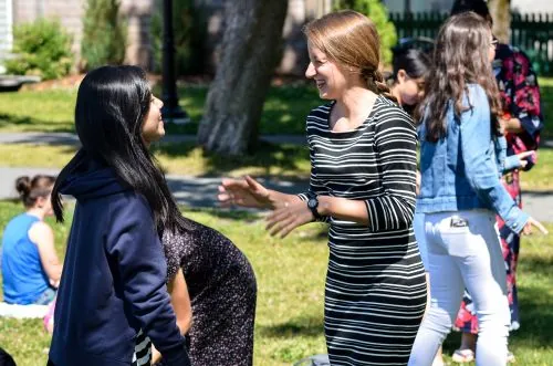 international students laughing in a park