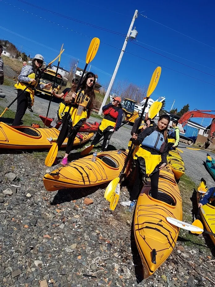students preparing for a kayaking trip